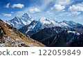 Snow-covered Alps and blue skies 122059849