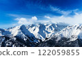 Snow-covered Alps and blue skies 122059855