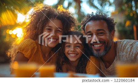 A father shares a delightful moment with his two daughters under golden sunset light, capturing their joy and connection in a lush garden. A father shares a delightful moment with his two daughters under golden sunset light, capturing their joy and connection in a lush garden. 122060184