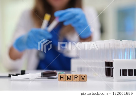 A medical professional expertly managing samples in a lab for precise testing and analysis 122061699