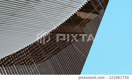 Contemporary Architectural Layers - Sleek Metallic Facade for Urban Development Concepts, Creative Marketing, or Innovative Design Portfolios Contemporary Architectural Layers - Sleek Metallic Facade for Urban Development Concepts, Creative Marketing, or Innovative Design Portfolios 122061738