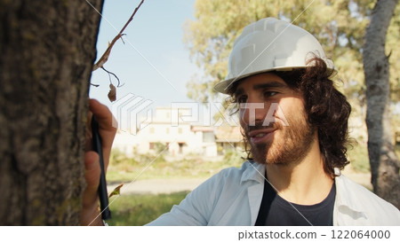Scientist Fascinated By The Beautiful Trunk Of A Tree In The Countryside 122064000