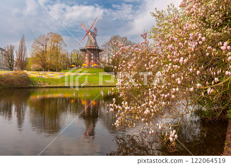 Spring flowers and a windmill on the wall, Bremen, Germany Spring flowers and a windmill on the wall, Bremen, Germany 122064519