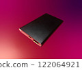 External battery for mobile devices. Power bank for charging mobile devices, isolated on colored background 122064921