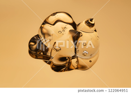 Tasty texture of cosmetic gel on a golden background. Tasty texture of cosmetic gel on a golden background. 122064951