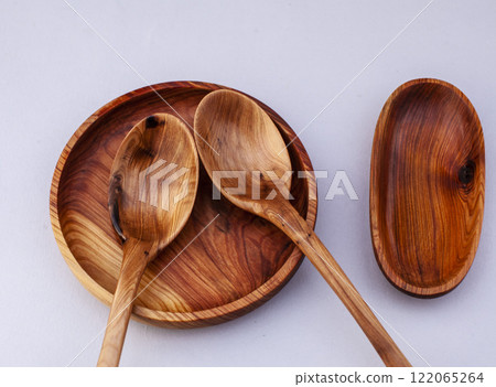 Wooden kitchen utensils stacked view close up isolated Wooden kitchen utensils stacked view close up isolated 122065264