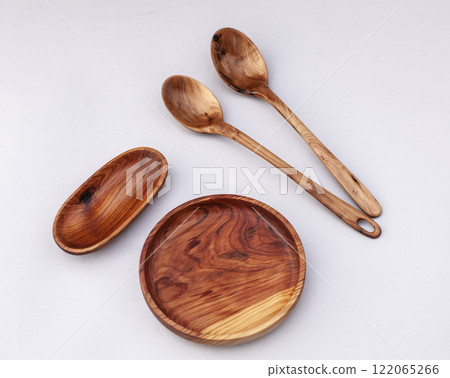 Wooden kitchen utensils stacked view close up isolated Wooden kitchen utensils stacked view close up isolated 122065266