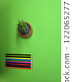 Pencils on a colored piece of paper. 122065277