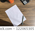 cozy home office desk with a white sheet of paper and plants. High quality photos 122065305