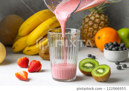 fresh smoothie pouring in glass fresh smoothie pouring in glass 122066955