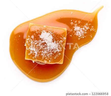 salted caramel candy in melted caramel sauc salted caramel candy in melted caramel sauc 122066958