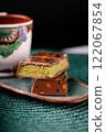 Dubai chocolate with pistachio filling on a black background. Copy space 122067854