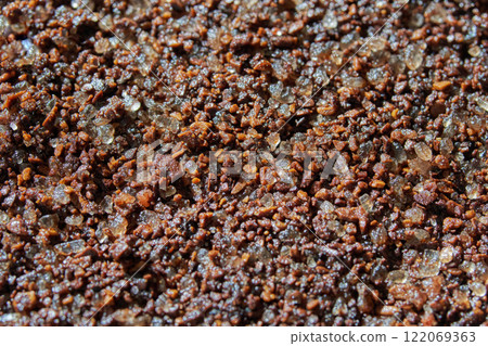 Close up of coarse brown sugar and coffee granules blended together in a texture Close up of coarse brown sugar and coffee granules blended together in a texture 122069363