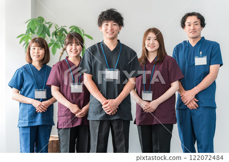 Doctors, caregivers, and osteopaths wearing scrubs Doctors, caregivers, and osteopaths wearing scrubs 122072484