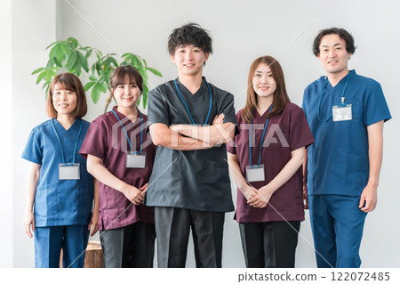 Doctors, caregivers, and osteopaths wearing scrubs Doctors, caregivers, and osteopaths wearing scrubs 122072485