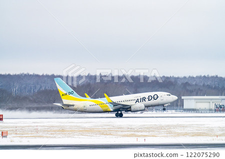 New Chitose Airport in winter: Snow smoke and planes taking off, Chitose, Hokkaido New Chitose Airport in winter: Snow smoke and planes taking off, Chitose, Hokkaido 122075290