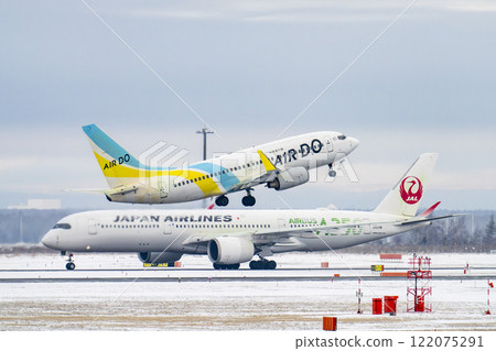 New Chitose Airport in winter: Snow smoke and planes taking off, Chitose, Hokkaido 122075291