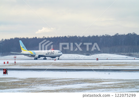 New Chitose Airport in winter: Snow smoke and planes taking off, Chitose, Hokkaido 122075299