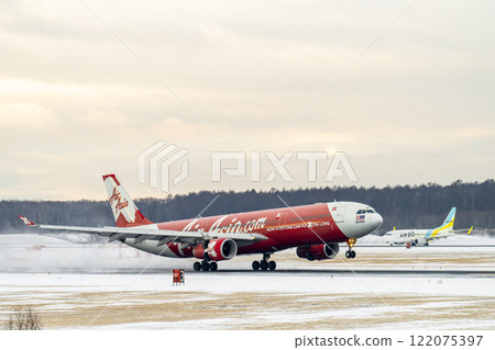 New Chitose Airport in winter: Snow plumes and landing planes, Chitose, Hokkaido New Chitose Airport in winter: Snow plumes and landing planes, Chitose, Hokkaido 122075397