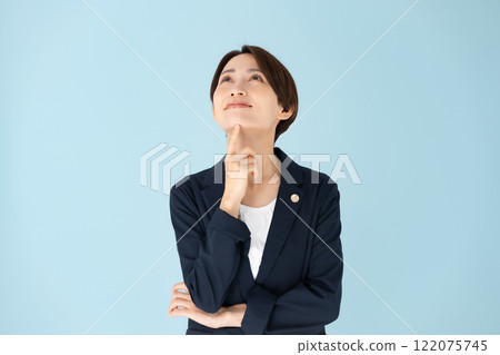 Female lawyer worried smile Female lawyer worried smile 122075745