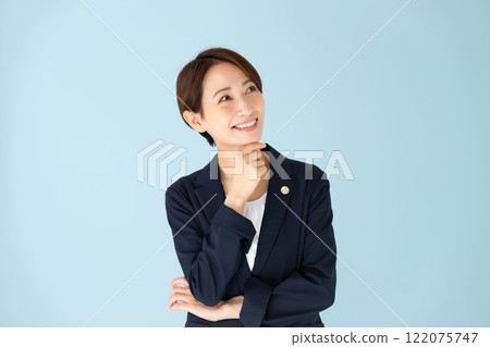 Female lawyer worried smile Female lawyer worried smile 122075747