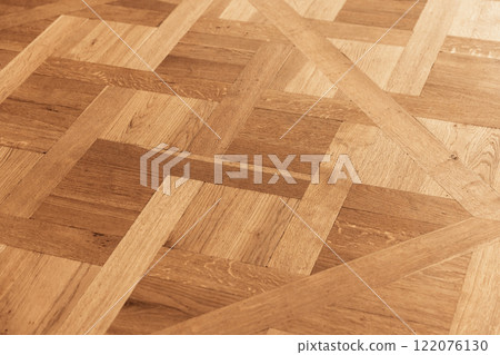 Vintage parquet made of oak wood planks with geometric pattern 122076130