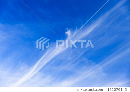 Soft stripes of cirrus clouds are in blue sky, natural background texture 122076143