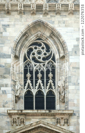 Window of a gothic cathedral in Milan 122076358