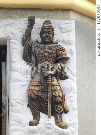 Warrior relief at the entrance of a Buddhist temple 122076590