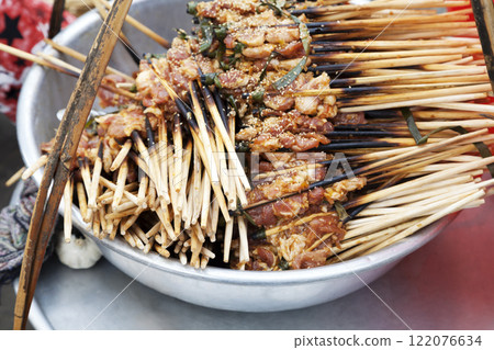 Small brochettes with cooked meat 122076634