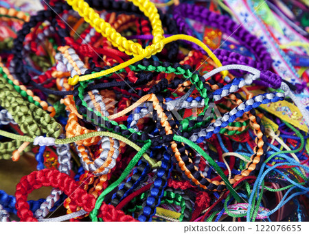 Handmade woven bracelets background Handmade woven bracelets background 122076655
