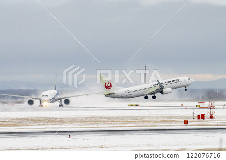 New Chitose Airport in winter: Snow smoke and planes taking off, Chitose, Hokkaido New Chitose Airport in winter: Snow smoke and planes taking off, Chitose, Hokkaido 122076716