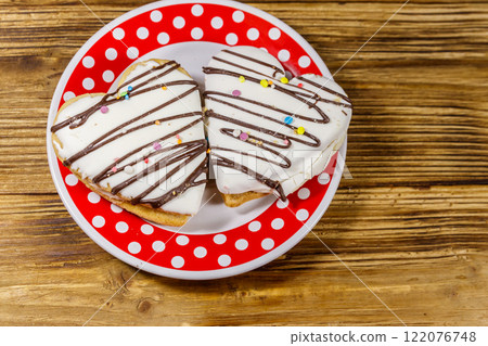 Heart shaped cookies on wooden table. Top view. Dessert for Valentine day Heart shaped cookies on wooden table. Top view. Dessert for Valentine day 122076748
