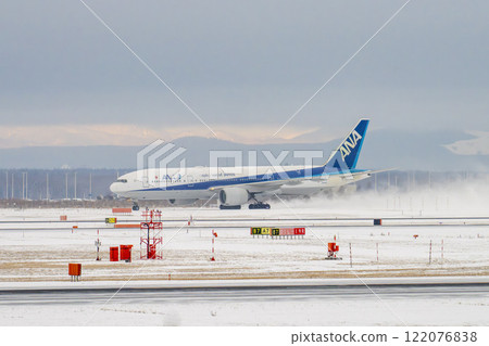 New Chitose Airport in winter: Snow smoke and taxiing airplanes, Chitose, Hokkaido New Chitose Airport in winter: Snow smoke and taxiing airplanes, Chitose, Hokkaido 122076838