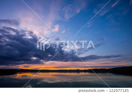 The Serene Sunset that illuminates the beauty of Tranquil Waters during dusk hours The Serene Sunset that illuminates the beauty of Tranquil Waters during dusk hours 122077185