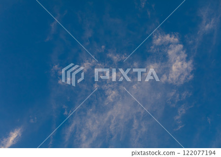 A Beautiful and Serene Blue Sky Decorated with Delicate and Wispy Clouds Above Us Today A Beautiful and Serene Blue Sky Decorated with Delicate and Wispy Clouds Above Us Today 122077194