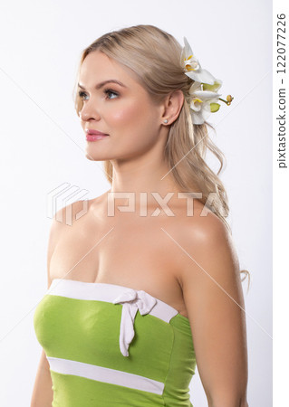This is a beautiful portrait of a Woman adorned with Flowers in her Hair and a lovely Green Dress 122077226