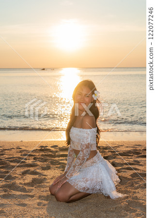 Beautiful Young Thai Woman at Tropical Beach During Sunset Beautiful Young Thai Woman at Tropical Beach During Sunset 122077246