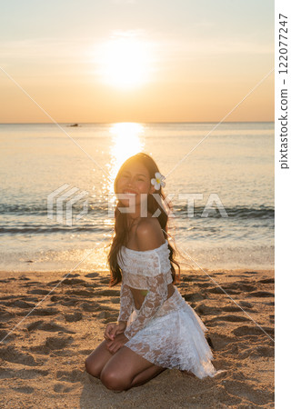 Beautiful Young Thai Woman at Tropical Beach During Sunset 122077247