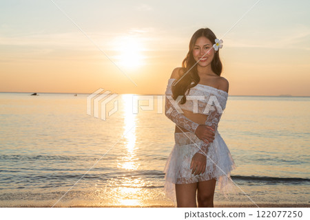 Beautiful Young Thai Woman at Tropical Beach During Sunset 122077250