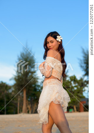 Beautiful Young Thai Woman at Tropical Beach During Sunset Beautiful Young Thai Woman at Tropical Beach During Sunset 122077261