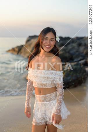 Beautiful Young Thai Woman at Tropical Beach During Sunset Beautiful Young Thai Woman at Tropical Beach During Sunset 122077265
