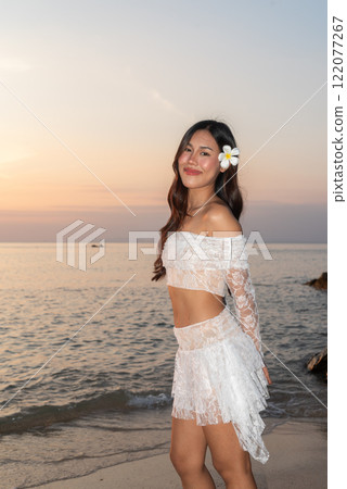 Beautiful Young Thai Woman at Tropical Beach During Sunset Beautiful Young Thai Woman at Tropical Beach During Sunset 122077267