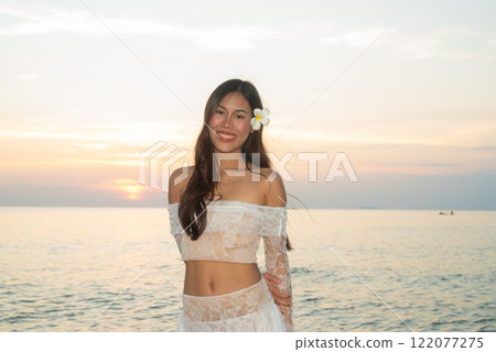 Beautiful Young Thai Woman at Tropical Beach During Sunset 122077275
