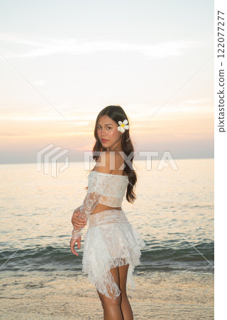 Beautiful Young Thai Woman at Tropical Beach During Sunset 122077277