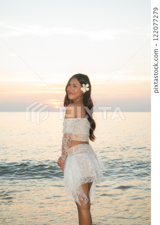 Beautiful Young Thai Woman at Tropical Beach During Sunset Beautiful Young Thai Woman at Tropical Beach During Sunset 122077279