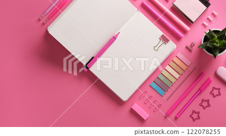 Horizontal stationery background with open notebook with stationery in pink theme. 122078255