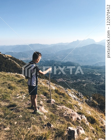 A young traveler on the top of a mountain 122078412