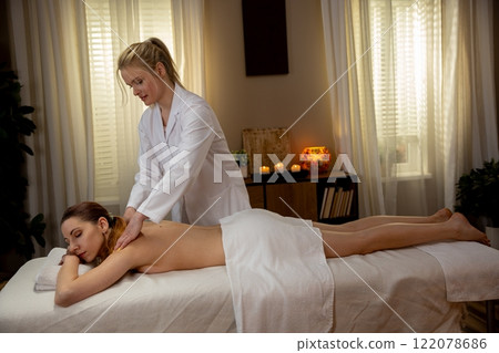Indulge in a Relaxing Massage Therapy Session within a Luxurious Tranquil Spa Setting Indulge in a Relaxing Massage Therapy Session within a Luxurious Tranquil Spa Setting 122078686