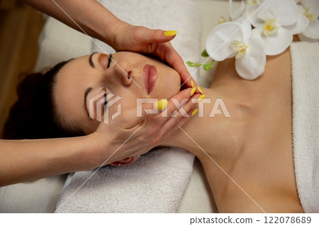 Indulge in a Relaxing Facial Massage Experience, Perfectly Set in a Tranquil Spa Environment 122078689